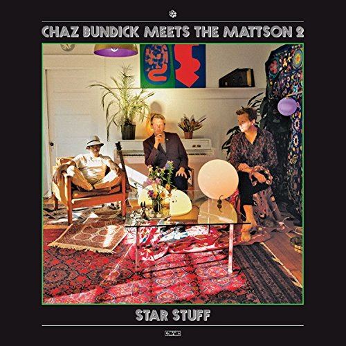 Album cover featuring three people in a patterned living room.