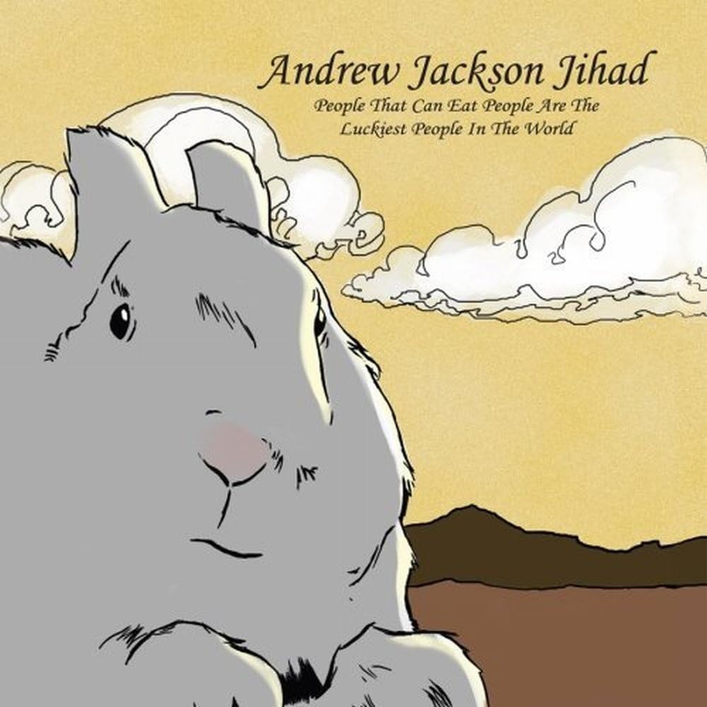 Album cover: illustrated bear head with clouds and mountains below.