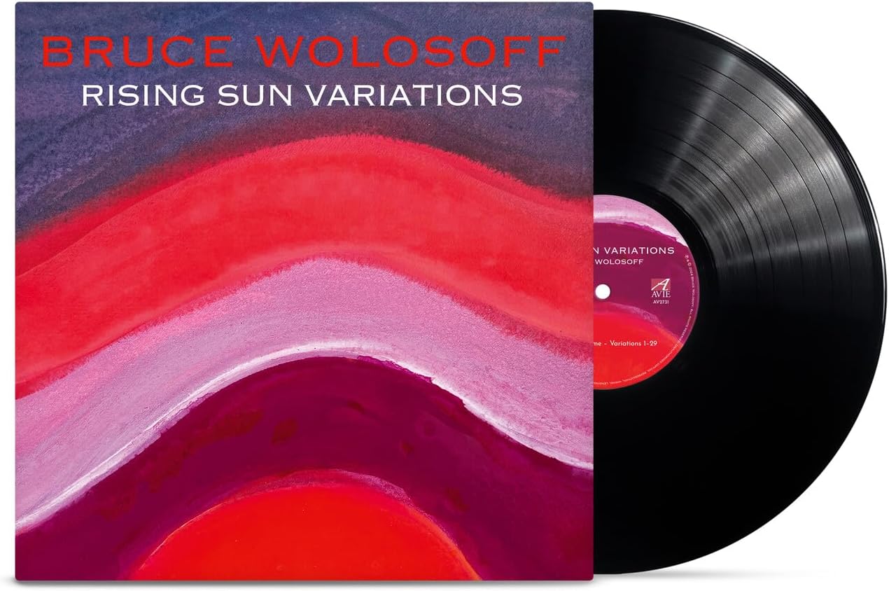 Vinyl record with colorful abstract album art and text: "Bruce Wolosoff - Rising Sun Variations".