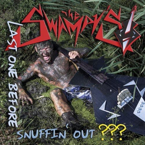 CD cover: Mud-covered person with a guitar in a swamp setting.