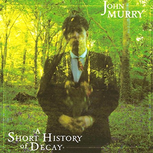 CD cover: man in suit partially obscured by forest imagery.