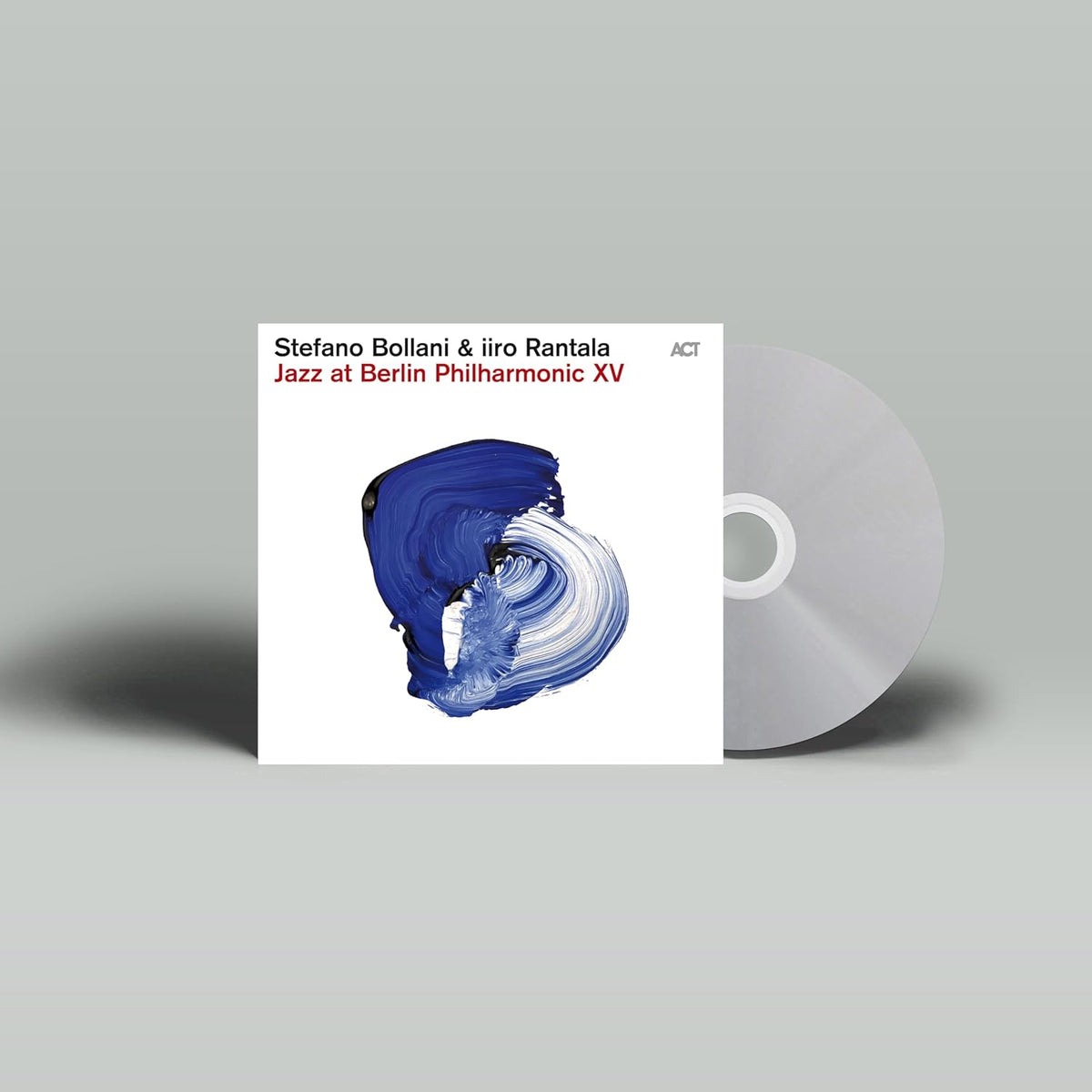 CD cover with abstract blue face and a silver disc shape.