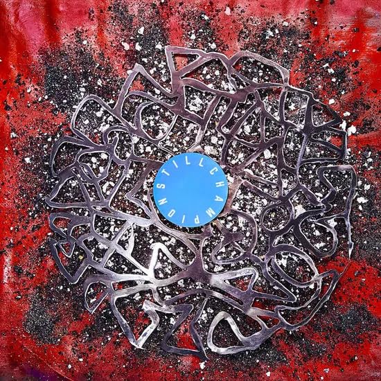 Vinyl record with abstract red and white splatter paint design.