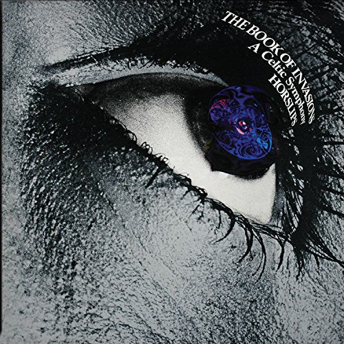 Album cover: close-up of an eye reflecting a swirling blue design.