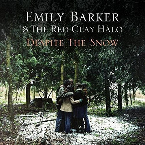 Album cover: group of people embrace in a snowy forest.