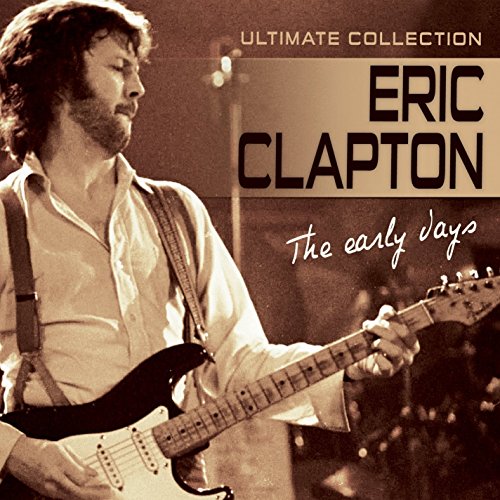 Eric Clapton playing guitar on CD cover, sepia toned.