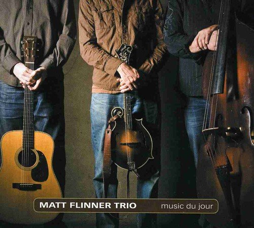 Three musicians with a guitar, mandolin, and upright bass.