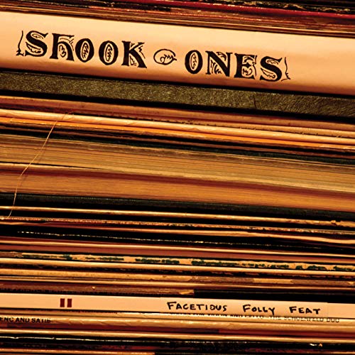 Vinyl record stack with "Shook Ones - Facetious Folly" text visible.