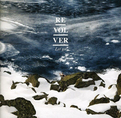 CD cover for “Let Go” by Revolver, featuring ocean waves and rocks.