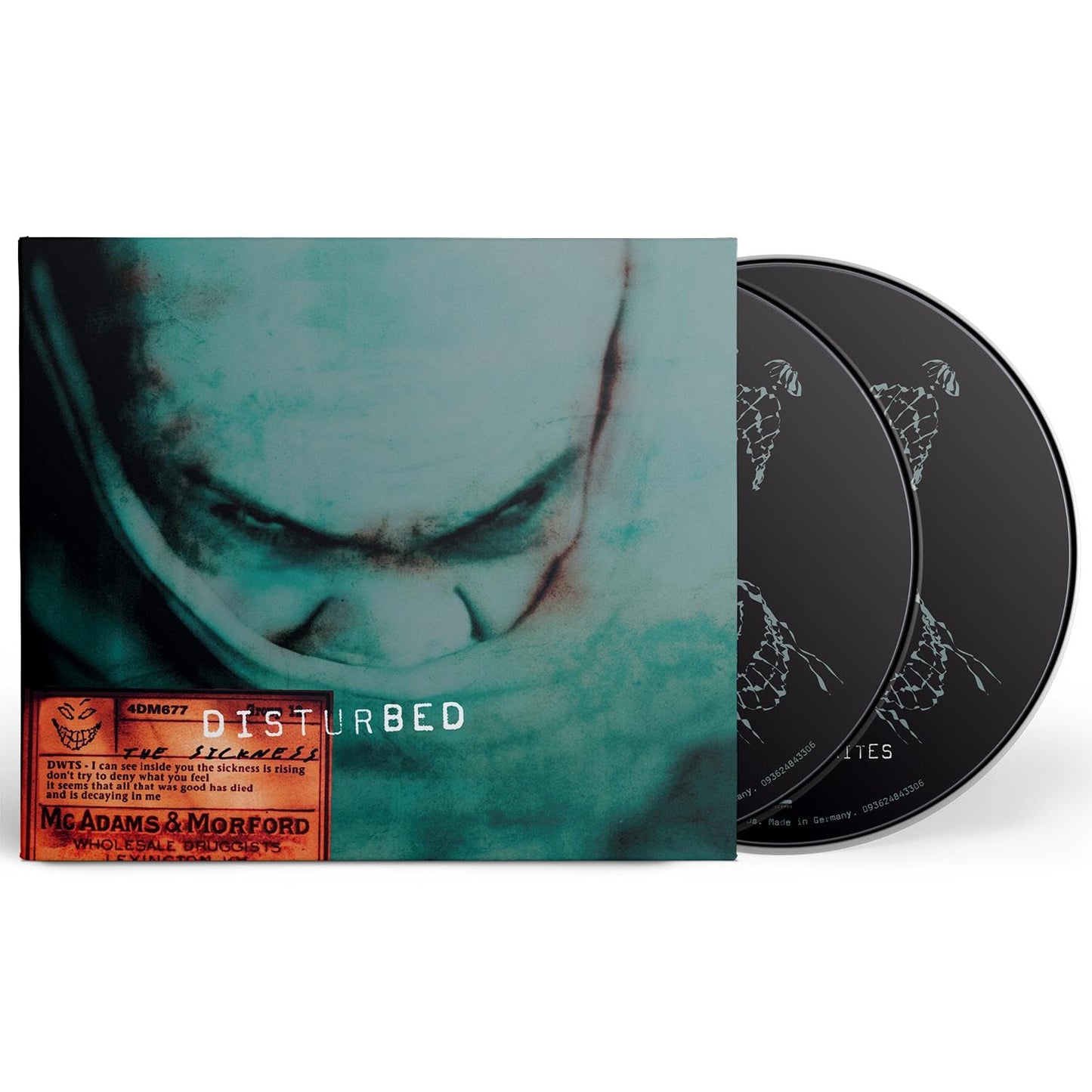 Disturbed’s “The Sickness” CD case and disc with a cracked, watery design.