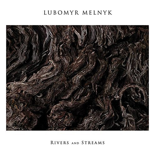 CD cover for Lubomyr Melnyk’s “Rivers And Streams” with abstract, dark wood texture.