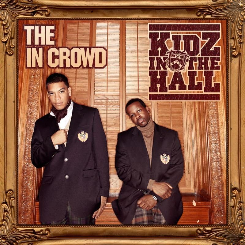 CD cover featuring two men in suits, ornate gold frame.