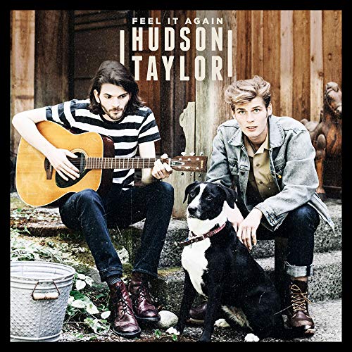 CD cover featuring two men with a guitar and a black dog.