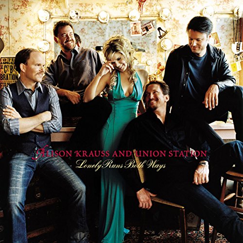 Alison Krauss & Union Station band portrait with rustic background.