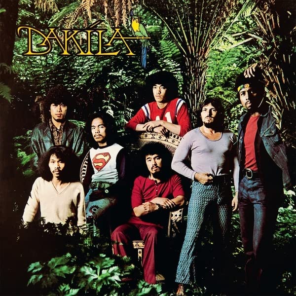 Dakila band portrait on album cover amidst lush green foliage.