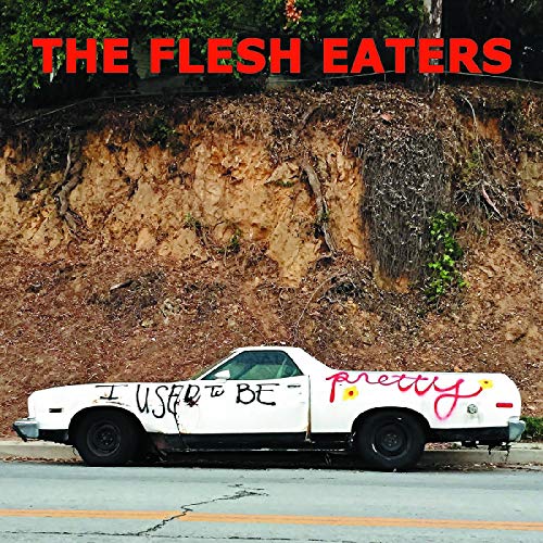 Album cover: white car with graffiti, hillside background, red text.