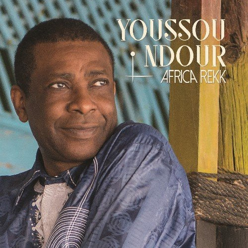 Youssou N'dour album cover, portrait of a smiling Black man.