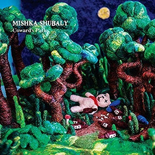 Album cover: a toy bear lies amongst sculpted green trees and foliage.