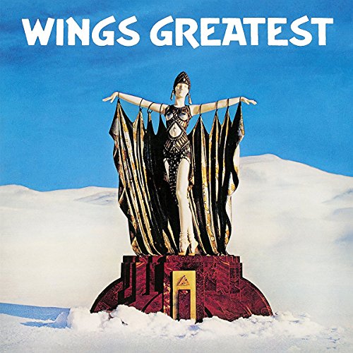 Wings Greatest album cover featuring a statue in a snowy landscape under blue sky.