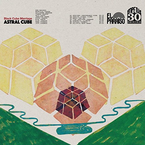 Vinyl album cover: geometric gold pattern with a red cube centerpiece.