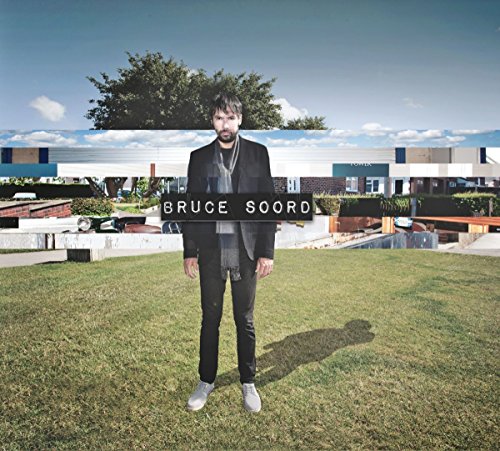 Album cover featuring Bruce Soord standing in front of a modern building.