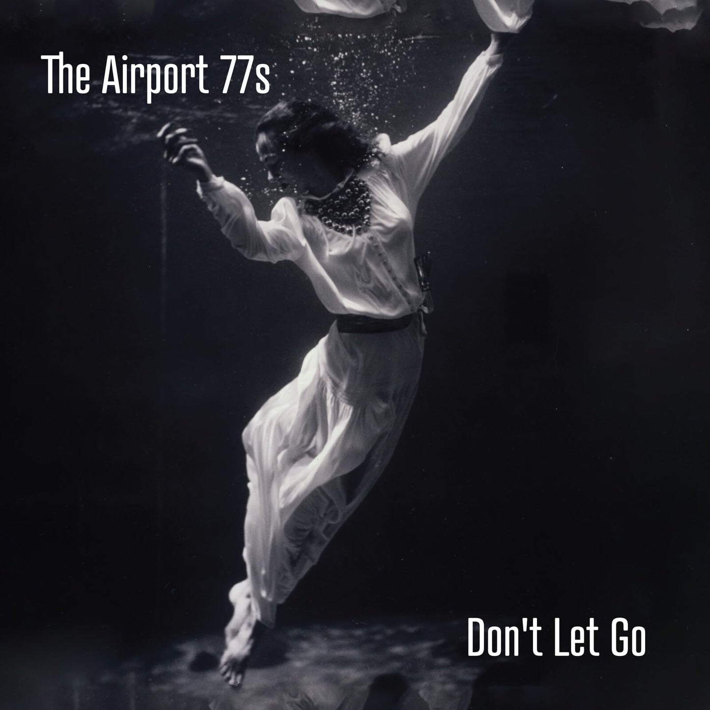Album cover for The Airport 77s’ “Don’t Let Go,” showing a submerged figure.