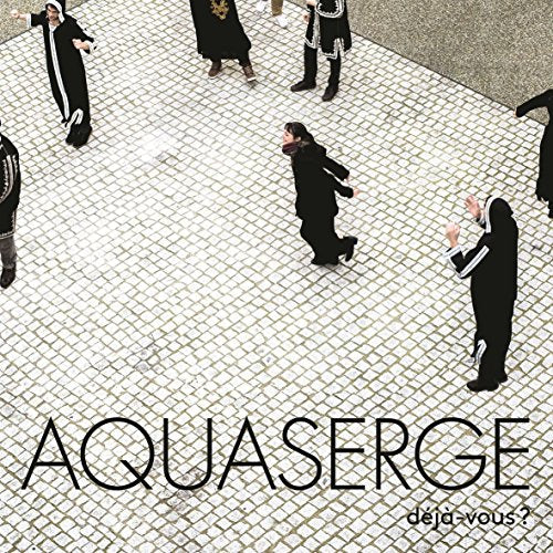 CD cover: Figures in dark robes on a patterned stone surface.