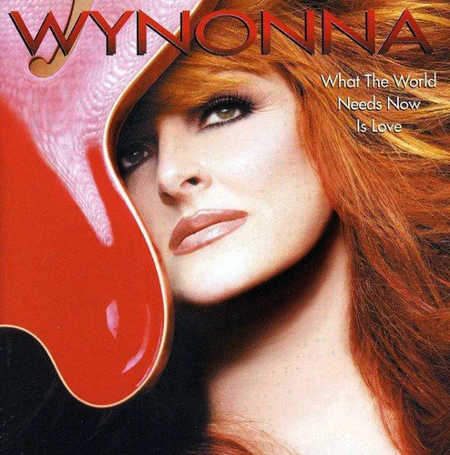 CD cover featuring Wynonna Judd with red and black background.