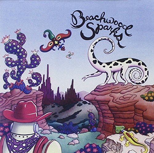 CD cover with colorful desert scene, cowboy hat, and reptile illustrations.