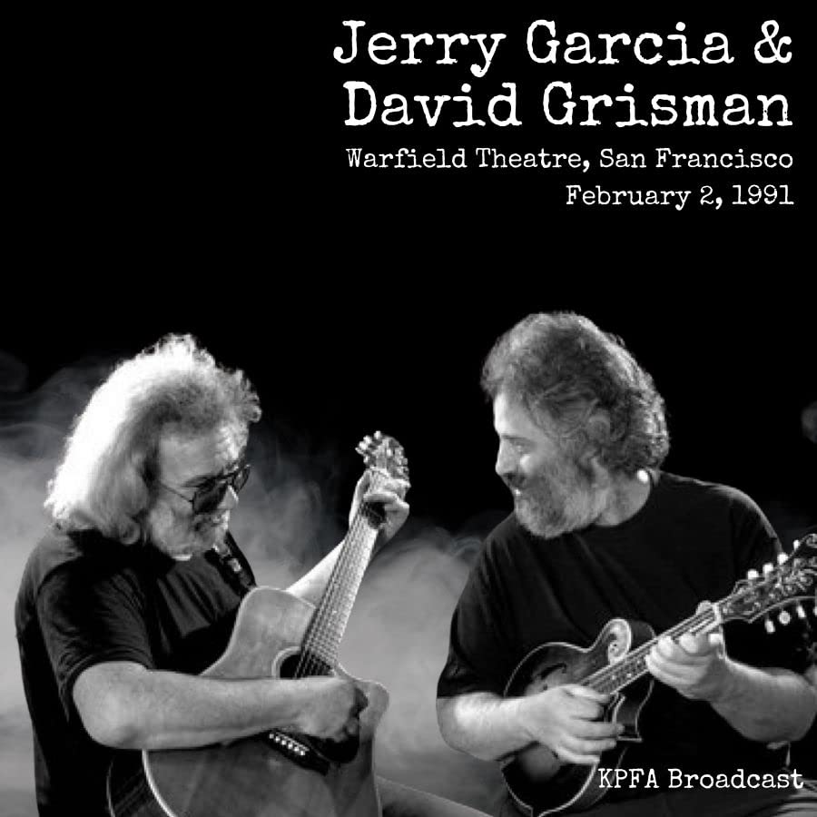 Black and white photo of Jerry Garcia and David Grisman playing acoustic guitars.