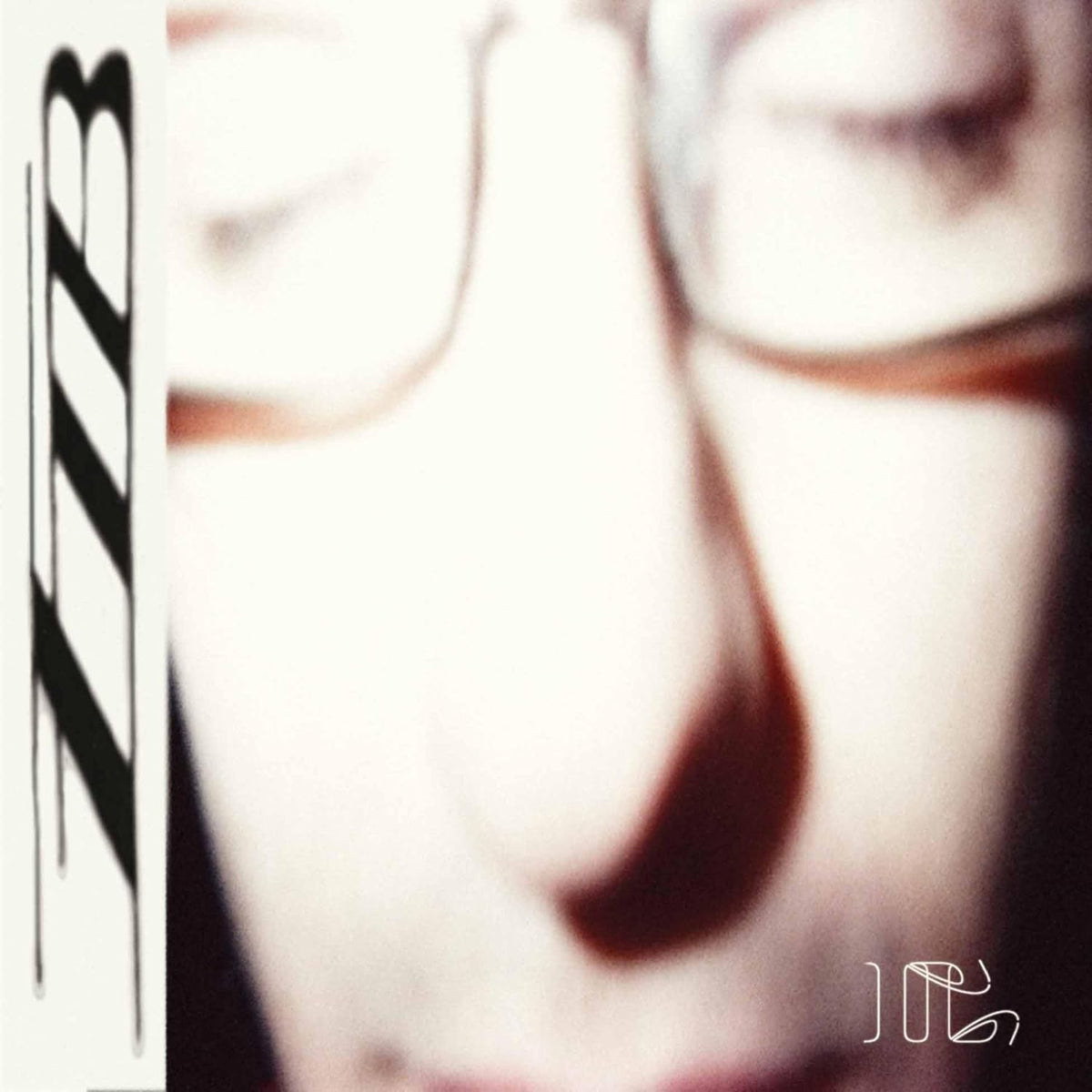 CD case with dark cover art, likely featuring abstract or industrial imagery.