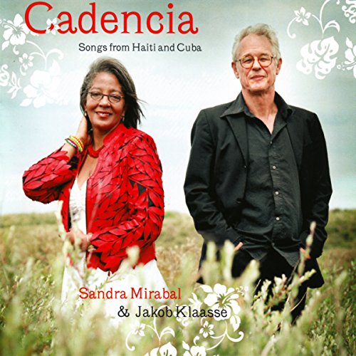 CD cover featuring two smiling people in a grassy field.
