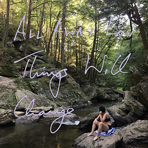 Album cover: forest landscape with text and a person by water.