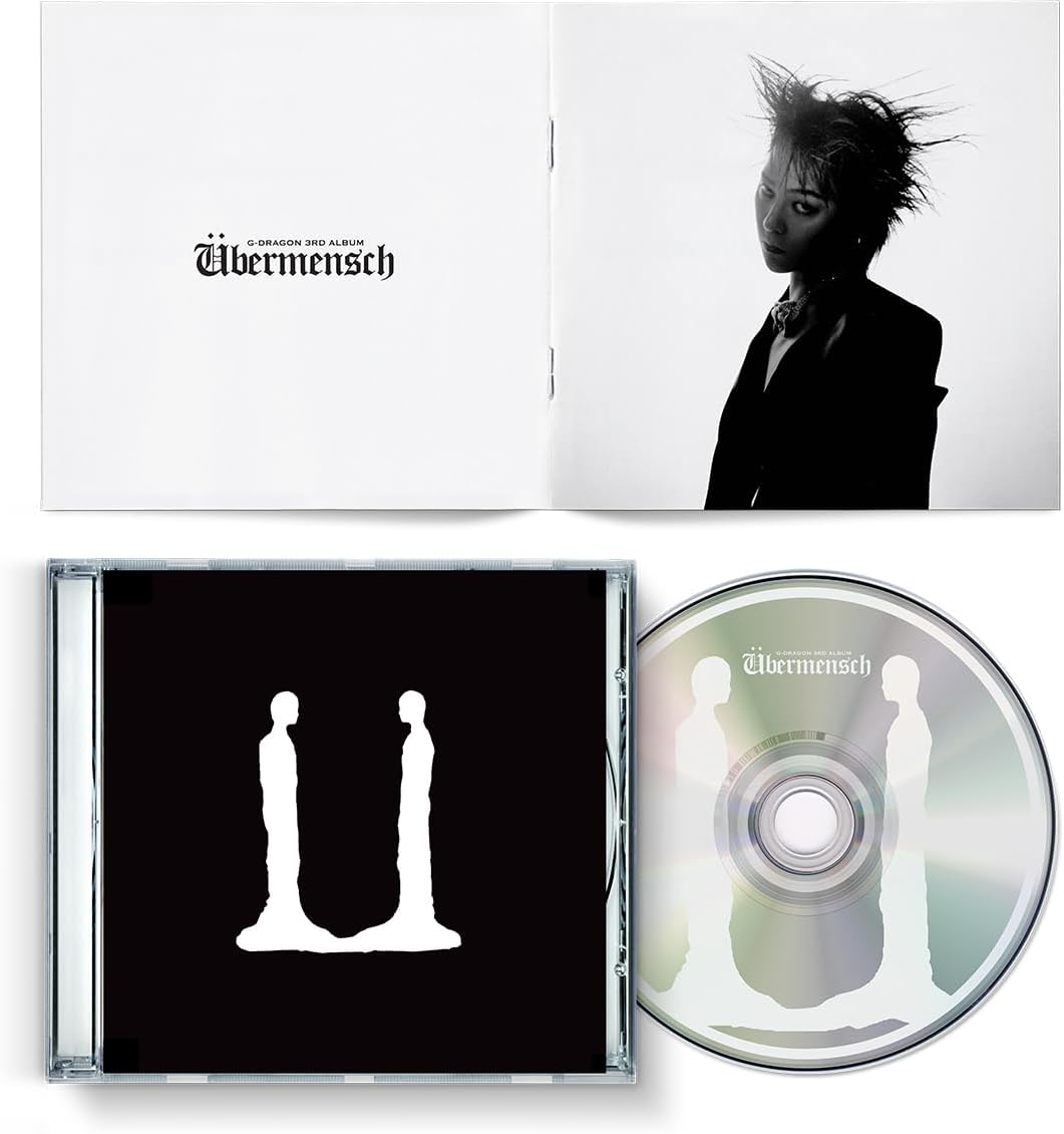 G-Dragon’s “Ubermensch” CD album with black cover and portrait.