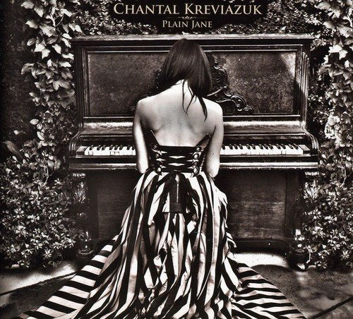 Black and white album cover featuring a woman at a piano.