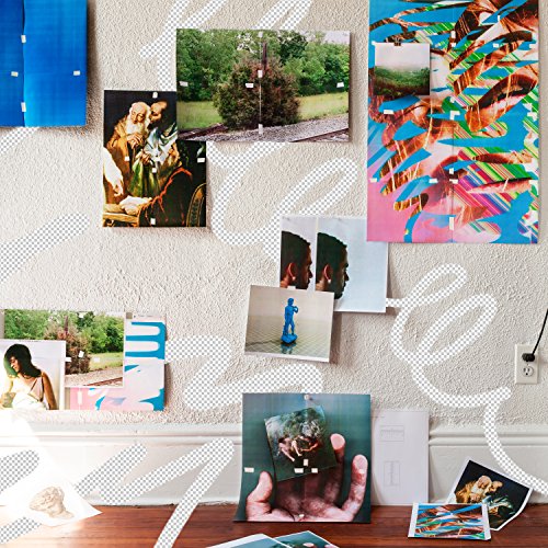 CD cover with collage of photos pinned to a textured wall.