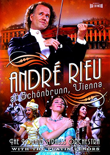 André Rieu playing violin at Schönbrunn Palace with performers and horses.