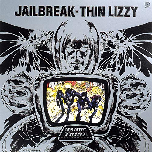“Jailbreak” vinyl album cover featuring a stylized, masked figure and band image.