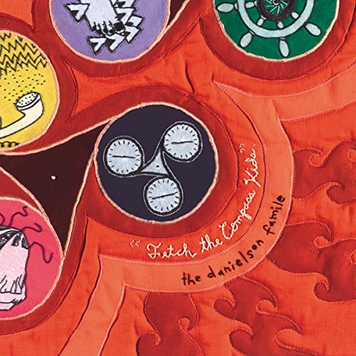 Red textured background with colorful circular designs and text: “Fetch The Compass Kids”.