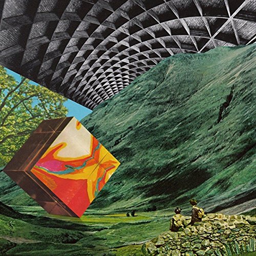 Collage of a landscape, geometric cube, and tunnel-like structure.