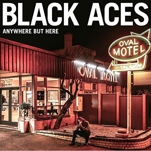 CD cover for Black Acesā āAnywhere But Hereā featuring a motel scene.