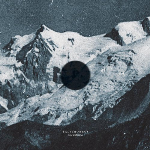 Snowy mountains with a dark circle, album cover for Talvihorros.