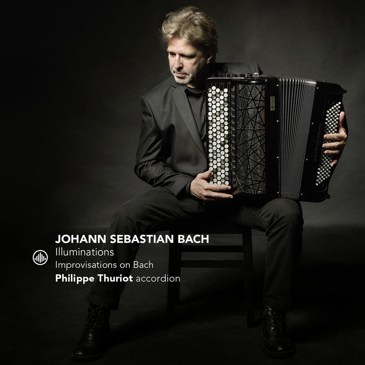 Man playing a black and silver accordion, album cover for "Illuminations.