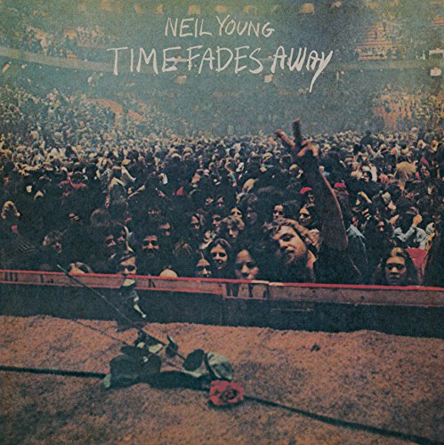 Neil Young’s “Time Fades Away” vinyl album cover, crowd and guitar.
