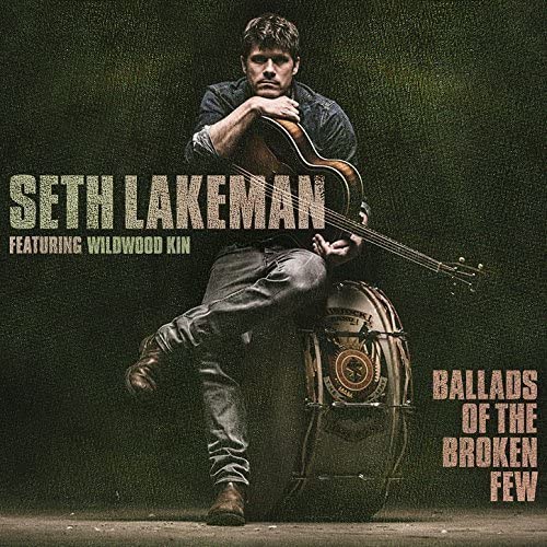 Seth Lakeman album cover featuring a man with a guitar and drum.