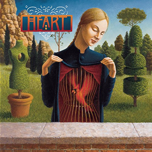 Album cover of Heart's Greatest Hits showing a woman with a birdcage in her chest.