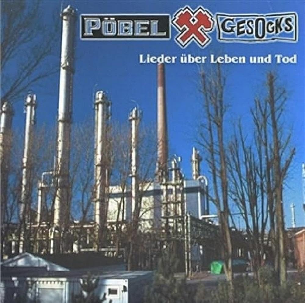 CD cover with industrial smokestacks against a bright blue sky.
