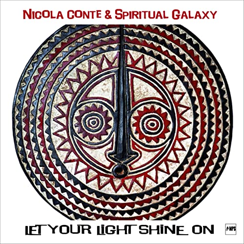 CD cover featuring a patterned, stylized African mask in red and brown.