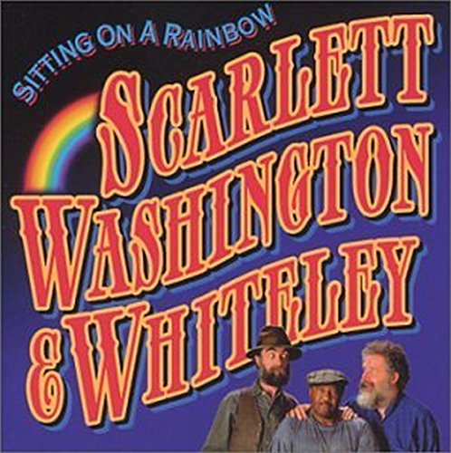 CD cover featuring three men and a rainbow arc above text.