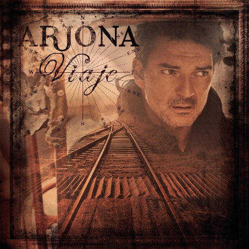 Ricardo Arjona's "Viaje" CD cover with a portrait and train tracks.